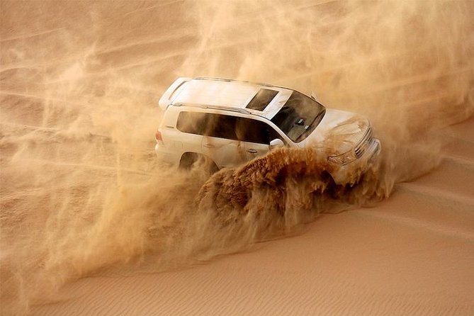 Abu Dhabi Private Desert Romantic Dune Dinner with Dune Bashing - Sandboarding, skiing, and optional quad bikes