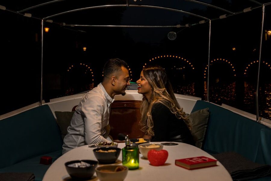 Amsterdam: Private Romantic Evening Boat Tour with Prosecco - A romantic view of Amsterdam after dark
