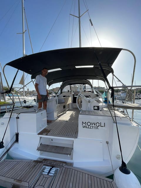 From Valletta: Romantic Sunset Cruise on a Sailing Yacht - The swimming stop and Manoel Island