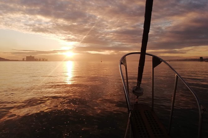 Marriage proposal on a Vintage Sailboat - Cristo Rei and the south-bank view