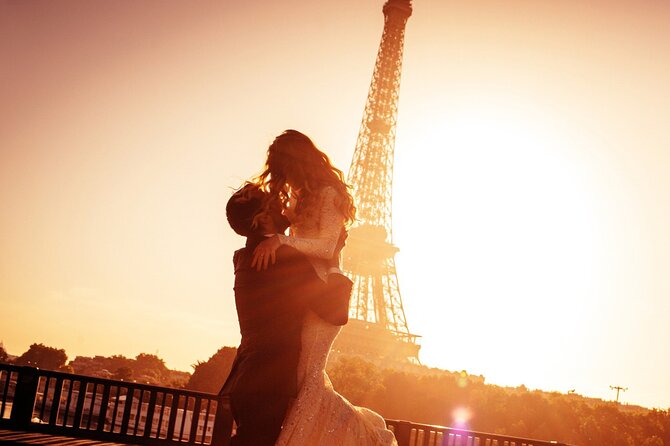 A couple at the Eiffel Tower as the light goes