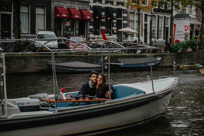 Private Romantic Canal Cruise Amsterdam with Bubbly and Snacks - Prosecco and snacks, with a small catch