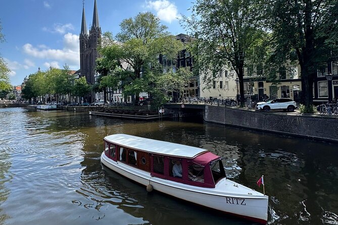 Romantic Private Boat Tour Amsterdam 90min incl welcome drink - The Skinny Bridge after sunset