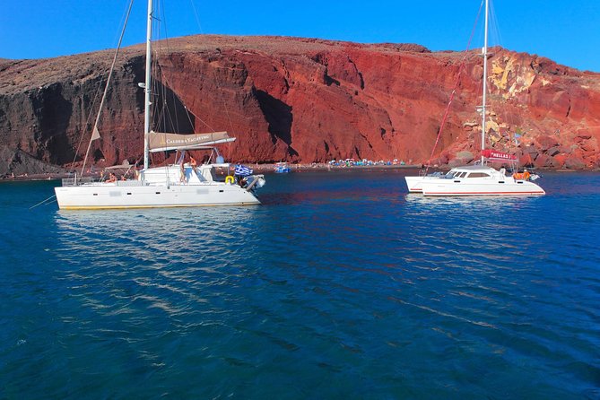 Shared Catamaran Romantic Sunset Cruise from Santorini via Volcano - Red Beach and Santorini’s unusual colors