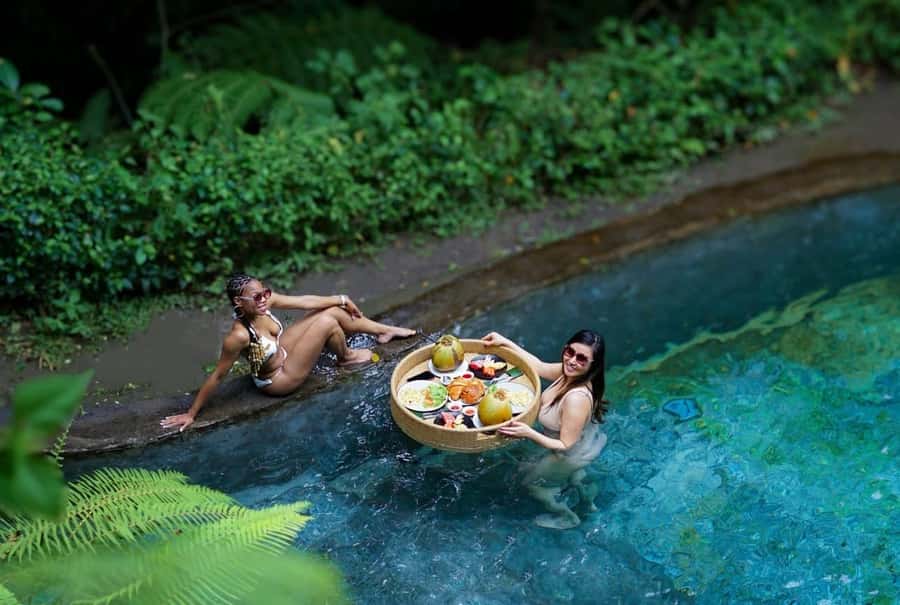 Ubud: Floating Breakfast, Jungle Swing & Spa Romantic Tour - Floating breakfast in a pool, with one important caveat