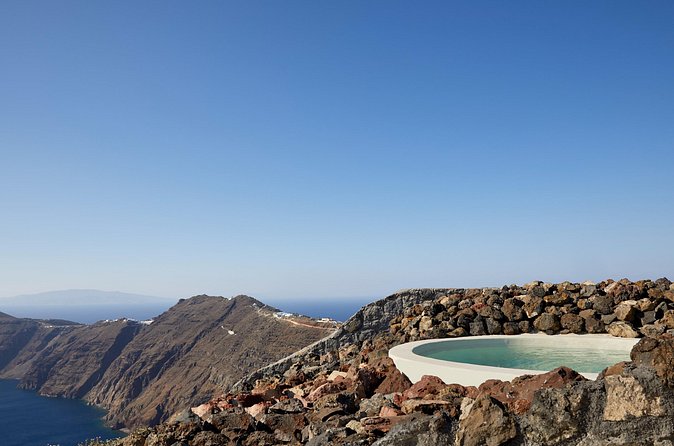 Volcanic Hot-Tub with Caldera View for Ultra-Romantic Couples - Cocktail, sparkling wine, and fresh fruit